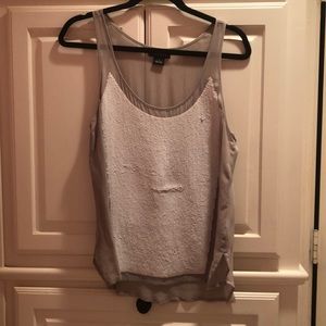 Nude with white tank top